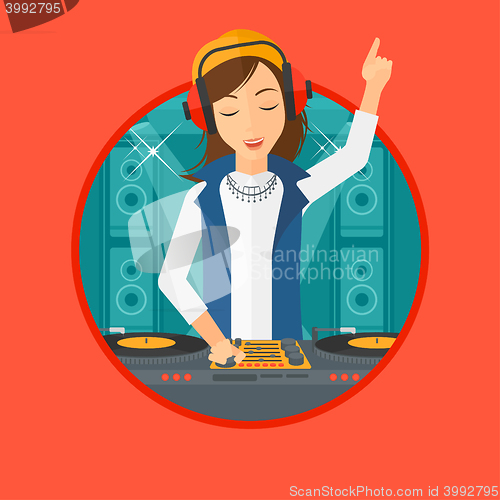 Image of Smiling DJ mixing music on turntables.