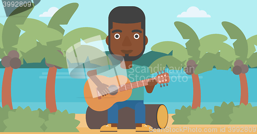 Image of Man playing guitar.