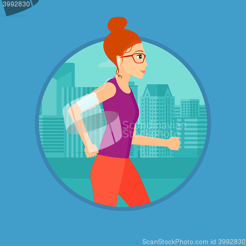 Image of Woman running with earphones and smartphone.