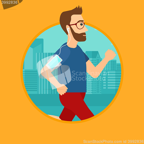 Image of Man running with earphones and smartphone.