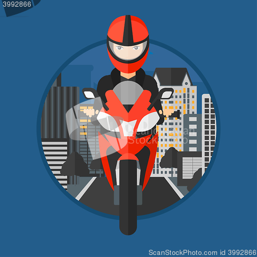 Image of Woman riding motorcycle.