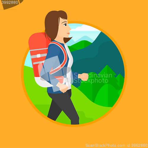 Image of Woman with backpack hiking.