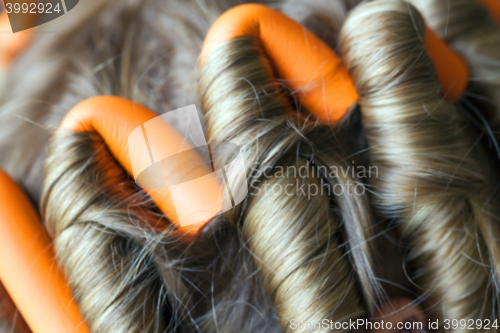 Image of curlers in her hair