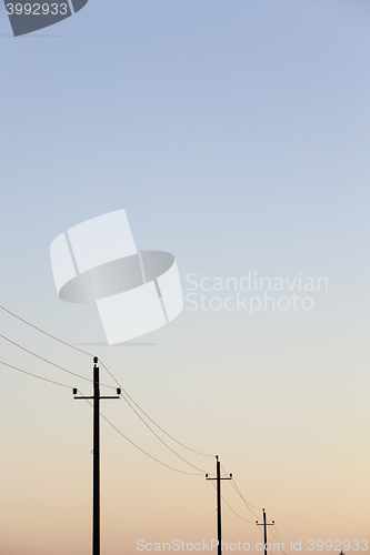 Image of power poles in the field