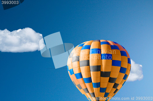 Image of Hot air balloon against brilliant blue sky