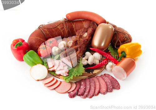 Image of sliced sausages with vegetables and red papper