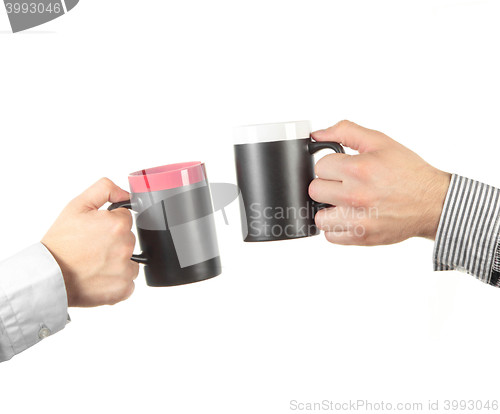 Image of Businessman hand holding a cup of tea