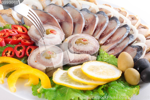 Image of fish with vegetables,anion red pepper