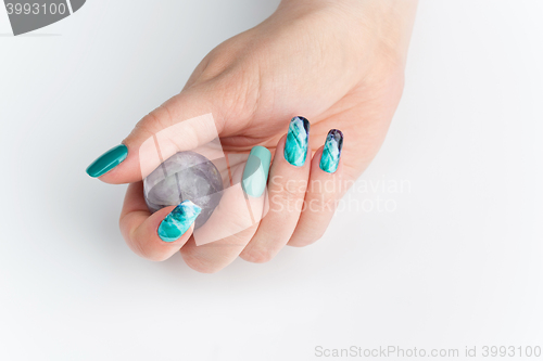 Image of Closeup of woman hands with colorful nails