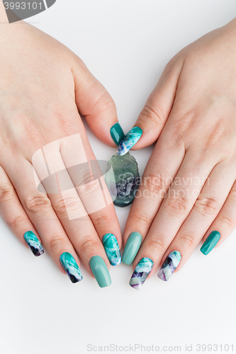 Image of Closeup of woman hands with colorful nails