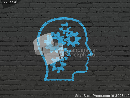 Image of Data concept: Head With Gears on wall background