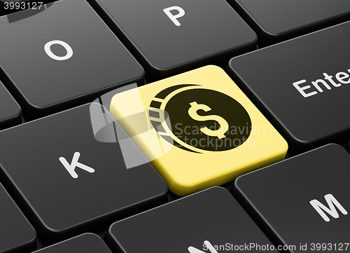 Image of Money concept: Dollar Coin on computer keyboard background