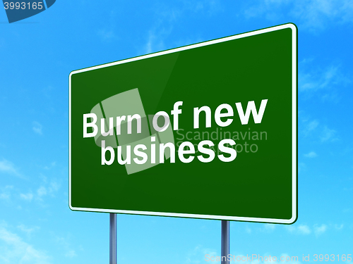 Image of Finance concept: Burn Of new Business on road sign background