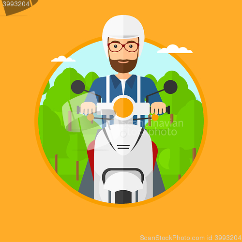 Image of Man riding scooter.