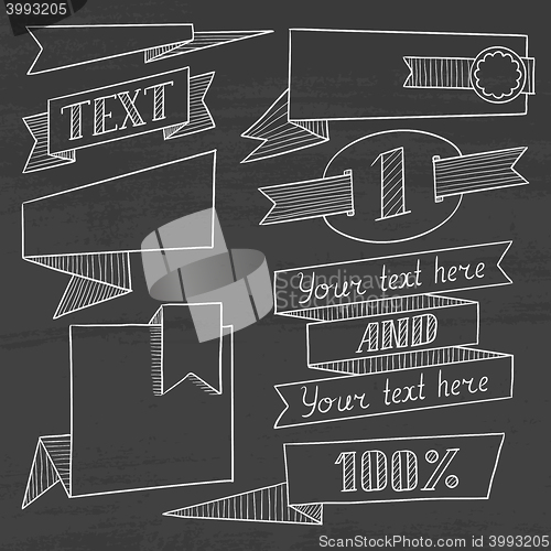 Image of Set of vintage ribbons, frames on a chalkboard.