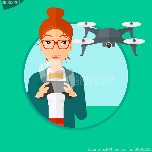 Image of Woman flying drone.