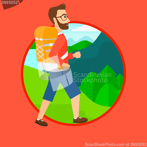 Image of Man with backpack hiking.