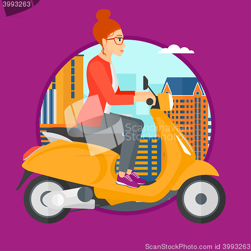 Image of Woman riding scooter.