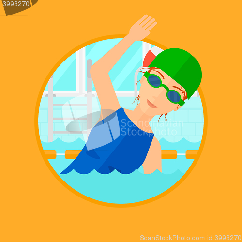 Image of Woman swimming in pool.