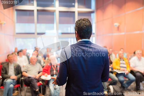 Image of Speaker at Business Conference and Presentation.