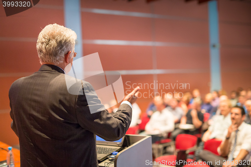 Image of Speaker at Business Conference and Presentation.