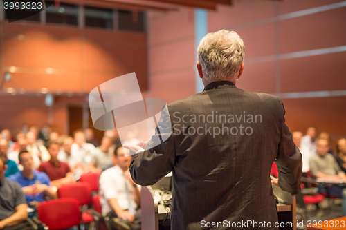 Image of Speaker at Business Conference and Presentation.