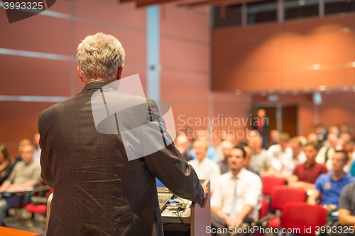 Image of Speaker at Business Conference and Presentation.