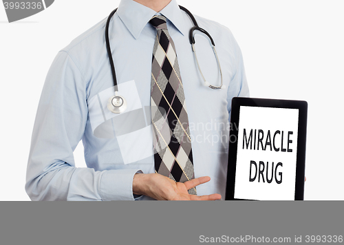 Image of Doctor holding tablet - Miracle drug