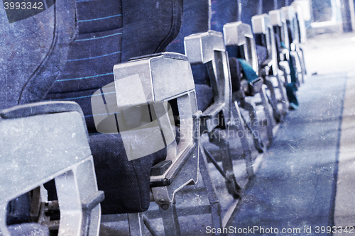 Image of Empty old airplane seats in the cabin, selective focus, vintage 