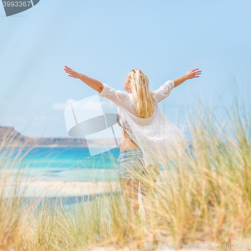 Image of Free Happy Woman Enjoying Sun on Vacations.