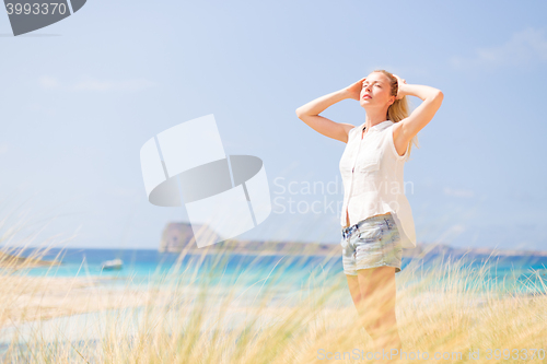 Image of Free Happy Woman Enjoying Sun on Vacations.