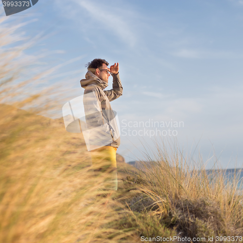 Image of Free active man enjoying beauty of nature.