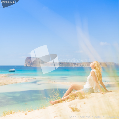 Image of Relaxed Happy Woman Enjoying Sun on Vacations.