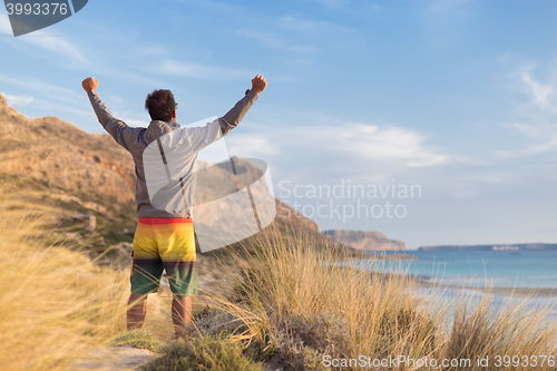 Image of Free active man enjoying beauty of nature.