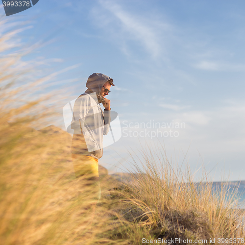 Image of Free active man enjoying beauty of nature.