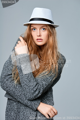 Image of Fashionable beautiful woman in warm knitted cardigan