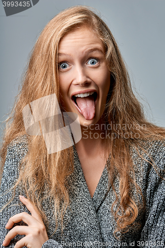 Image of Woman playfully sticking her tongue out