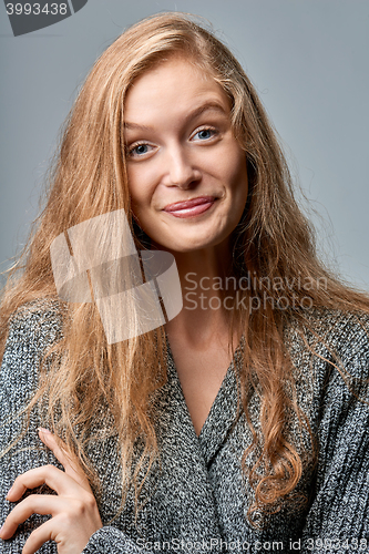 Image of Happy laughing woman in warm knitted cardigan