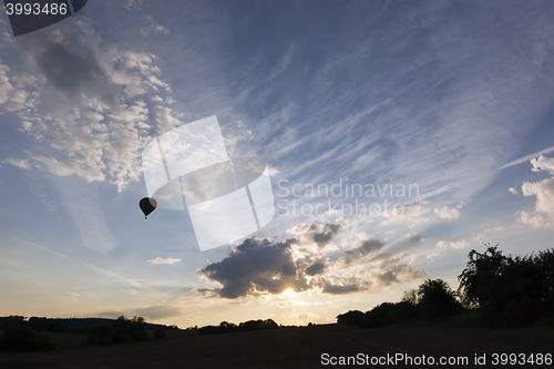 Image of Sunset sky and silhouette of a hot air balloon
