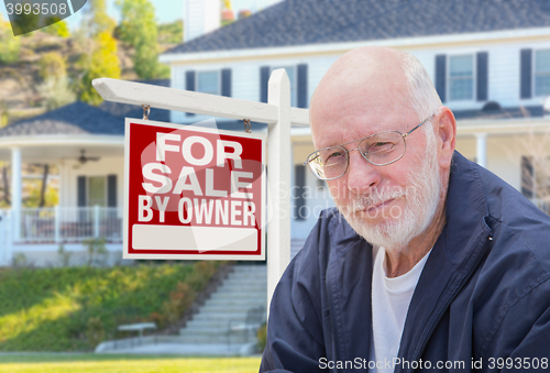 Image of Senior Adult Man in Front of Real Estate Sign, House