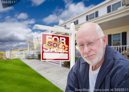 Image of Senior Adult Man in Front of Real Estate Sign, House