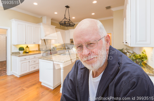 Image of Happy Senior Man In Custom Kitchen Interior