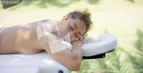 Image of View on massage table with woman laying