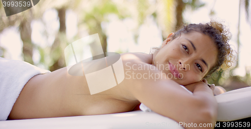 Image of Woman on massage table looking up