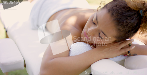 Image of Top down view of woman on massage table