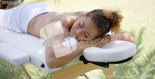 Image of View on massage table with woman laying