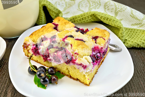 Image of Pie with black currant in plate on board