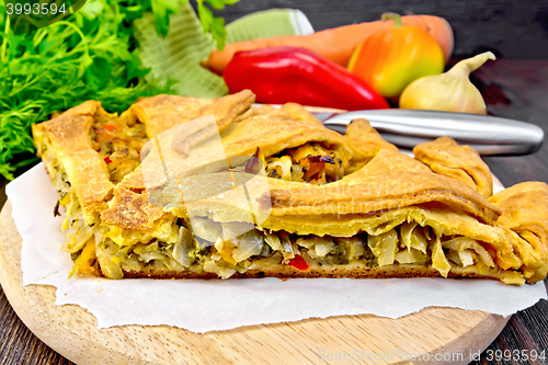 Image of Pie with cabbage and sorrel on parchment