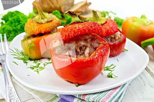 Image of Pepper stuffed meat and rice in plate on table