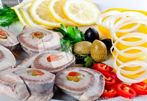 Image of sliced fish with vegetables